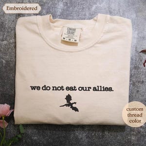 a t - shirt with the words we do not eat our allies on it