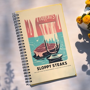 Può includere: Quaderno a spirale con copertina gialla. L'illustrazione retrò raffigura una bistecca, un bicchiere d'acqua e il testo "Truffoni's SLOPPY STEAKS". La didascalia recita: "THEY CAN'T STOP YOU FROM ORDERING A STEAK AND A GLASS OF WATER."