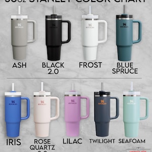 May include: A 30oz Stanley color chart displaying nine tumblers with handles and straws in various colors labeled Ash, Black 2.0, Frost, Blue Spruce, Iris, Rose Quartz 2.0, Lilac, Twilight, and Seafoam, with the Henkle's Engraving logo at the bottom.