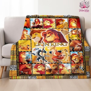 May include: A plush throw blanket featuring a collage of images from Disney's "The Lion King." The design includes various characters and scenes from the movie, set against a yellow and black background. The blanket is draped over a beige sofa.