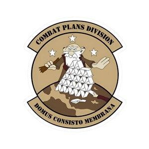 May include: A sticker featuring a cartoon illustration of an elderly man with a white beard, building a house of cards. The sticker has a tan background with the text "COMBAT PLANS DIVISION" and "DOMUS CONSISTO MEMBRANA".