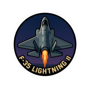 May include: A round sticker featuring a stylized illustration of an F-35 Lightning II fighter jet. The jet is gray with orange exhaust flames against a dark blue background. The text "F-35 LIGHTNING II" is in white, curved around the bottom of the image.