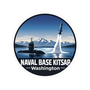 May include: A round sticker featuring a submarine and a missile launching from the water, with mountains and a blue sky in the background. The text "NAVAL BASE KITSAP - Washington" is displayed.