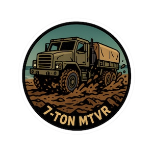 May include: A sticker featuring a cartoon illustration of a 7-Ton MTVR military truck driving through mud. The truck is olive green with a tan cargo cover, set against a backdrop of a beach and teal sky. The text "7-TON MTVR" is at the bottom.