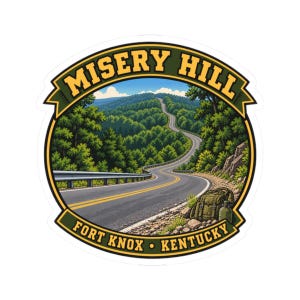 May include: A circular sticker featuring a winding road through a lush green forest. The text MISERY HILL is arched at the top, and FORT KNOX • KENTUCKY is at the bottom. A green backpack and canteen sit on the rocky roadside in the foreground.