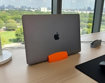 Minimal vertical laptop stand for 12–22 mm devices, space-saving desk holder for home office setups