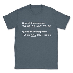 May include: A dark blue t-shirt with white text that reads "Normal Shakespeare: TO BE OR NOT TO BE" and "Quantum Shakespeare: TO BE AND NOT TO BE".