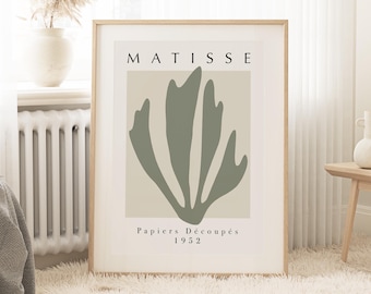 May include: A framed print with a green abstract floral design and the text "MATISSE Papiers Découpés 1952".
