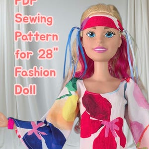 May include: A fashion doll with blonde and pink hair wearing a headband and a dress with a colourful floral pattern. The text PDF Sewing Pattern for 28" Fashion Doll is visible on the left side of the image. The doll has blue eyes and pink lips.