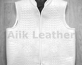 May include: White leather vest with a crocodile pattern and a zipper closure.