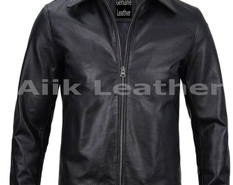 May include: Black leather jacket with a collared neckline and a full-length zipper. The jacket has long sleeves and the text "Genuine Leather" is visible on a tag inside the collar. The brand name "Ailk Leather" is printed on the bottom of the jacket.