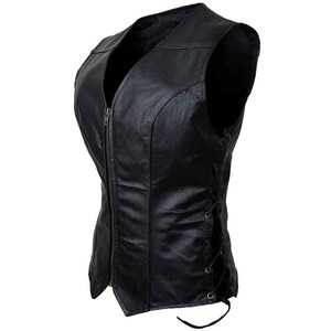 May include: Black leather vest with a V-neck, a front zipper, and lace-up detailing on the sides. The vest has a fitted silhouette and is designed to be worn as outerwear. The leather appears to be smooth and has a slight sheen.