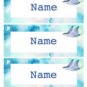 May include: Three blue and green watercolor name tags with a stylized stingray illustration in the top right corner. Each tag has the word "Name" printed in dark blue.