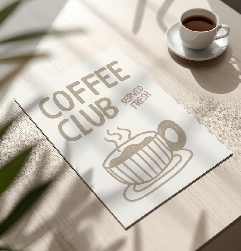 May include: A white rectangular sign with the words "COFFEE CLUB SERVED FRESH" in a light brown color. A light brown illustration of a coffee cup is below the text. A white coffee cup and saucer are on the right.