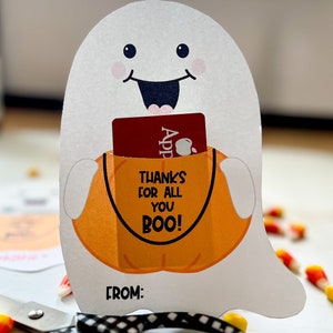 May include: A white ghost holding a pumpkin with a gift card inside. The pumpkin has the text "Thanks for all you BOO!" and the ghost has a "FROM:" label at the bottom.