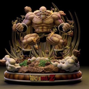 May include: A detailed figurine of a muscular character from Dragon Ball Z. The figure is in a dynamic pose, with a tan skin tone and black shorts. The base features the Dragon Ball Z logo and a brown and gold colour scheme.