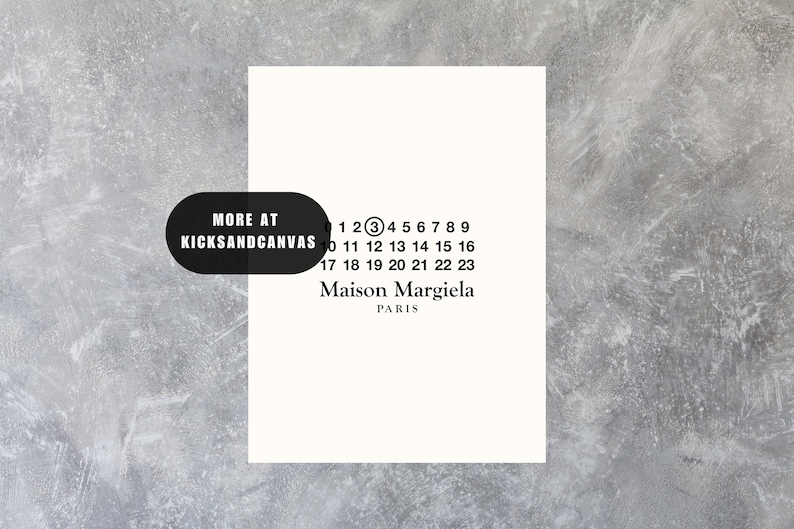 May include: A white card with black text that reads "MORE AT KICKSANDCANVAS" and "1 2 3 4 5 6 7 8 9 10 11 12 13 14 15 16 17 18 19 20 21 22 23 Maison Margiela PARIS".