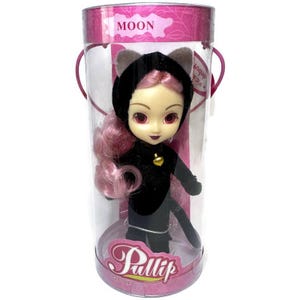May include: A Pullip doll with pink hair and a black cat-ear hood inside a clear cylindrical display case. The doll wears a black outfit with a small gold bell at the neck. The packaging features the text MOON at the top and Pullip at the base.