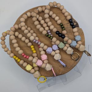 May include: A rustic wooden sign with the text "Welcome to our home" in white lettering. The sign features a distressed finish and a simple, inviting design, perfect for entryway decor.