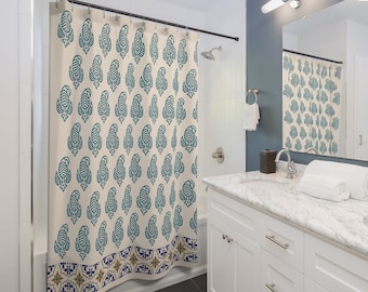 May include: A shower curtain with a cream background and a teal paisley pattern. The bottom border features a colorful tile design.