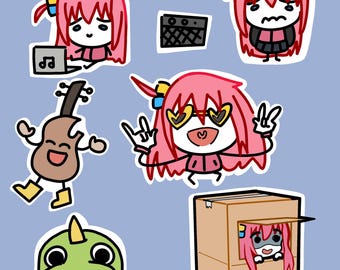 May include: A set of colorful cartoon stickers featuring a girl with pink hair in various poses, including playing guitar, wearing sunglasses, and hiding in a box. The text "まっちごっこ!" is written in Japanese at the top of the image.
