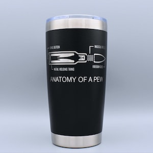 May include: Black stainless steel tumbler with a white graphic of a bullet and the text "Anatomy of a Pew". The graphic includes labels for "Bang Button", "Metal Holding Thing", "Freedom Seeds", and "Magical Fire Element".