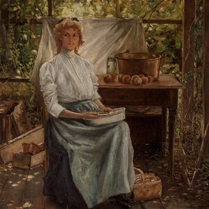 May include: An oil painting shows a woman seated outdoors, bathed in sunlight. She wears a white blouse and a long blue skirt, holding a tray. A table holds a copper pot and apples. A basket of apples sits nearby, with a backdrop of foliage.