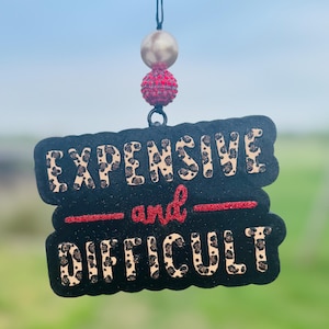 May include: A handmade, wooden cutting board with a natural finish. The board features a live edge on one side and a rectangular shape. It is approximately 18 inches long, 12 inches wide, and 1 inch thick.