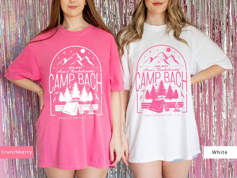 May include: Two oversized t-shirts with a pink and white mountain scene graphic. The graphic says "June 2024 Ava's Bachelorette Camp Bach Breckenridge, CO". One shirt is pink and the other is white.