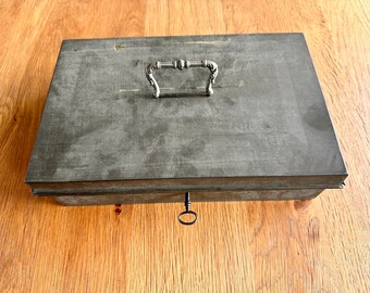 Vintage zinc cash box including key