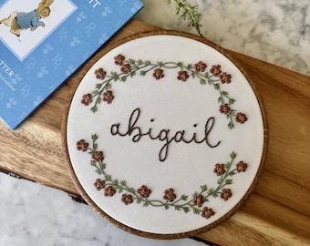 Custom Name Embroidery Hoop — Hand Embroidered Floral Script | Nursery Wall Art