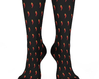 May include: A pair of black socks with a red and yellow pepper pattern. The socks are crew length and have a black toe and heel.