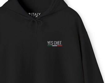 May include: Black hooded sweatshirt with the text "YES CHEF." in white lettering and a small Italian flag graphic below.