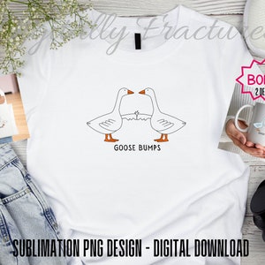 May include: White sublimation t-shirt design featuring two cartoon geese with the text "Goose Bumps". The design is perfect for a funny, quirky, or sarcastic gift.