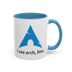 May include: White ceramic mug with a blue rim and handle. The mug features a blue Arch Linux logo and the text "I use arch, btw."