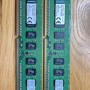May include: Two green Kingston 8GB 2Rx8 PC3-10600E-9-13-E3 KTA-MP1333/8G 1.5V BSMH1811501 memory modules. The modules are labeled with the Kingston logo, SK hynix, and the text "Warranty Void If Removed".