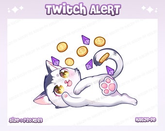 May include: A white cat with grey markings lies on its side with its paw raised. The cat is surrounded by purple gems and gold coins. The text "Twitch Alert" is at the top of the image. The text "katze-fe" is at the bottom of the image.