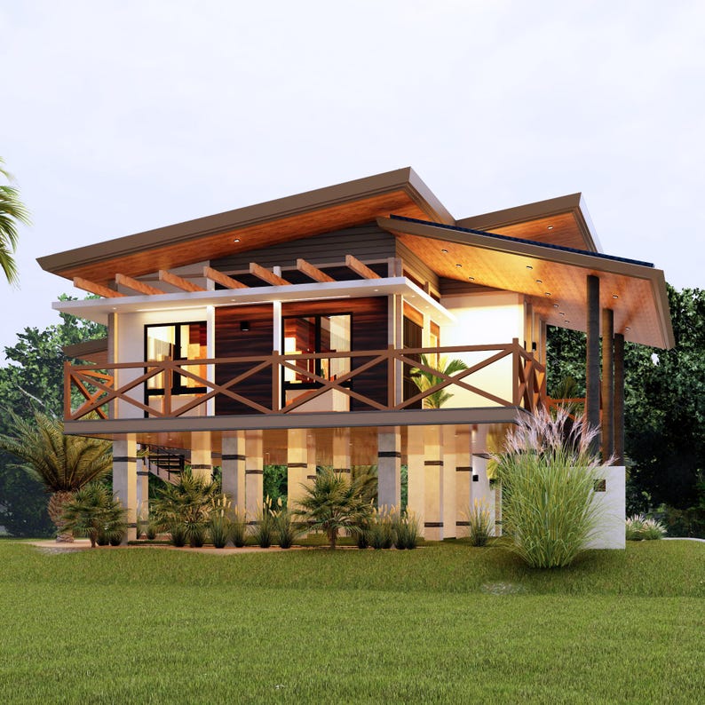 May include: A modern, wooden house with a large, covered porch and a wooden railing. The house is elevated on stilts and has a brown roof. The house is surrounded by lush green grass and trees.