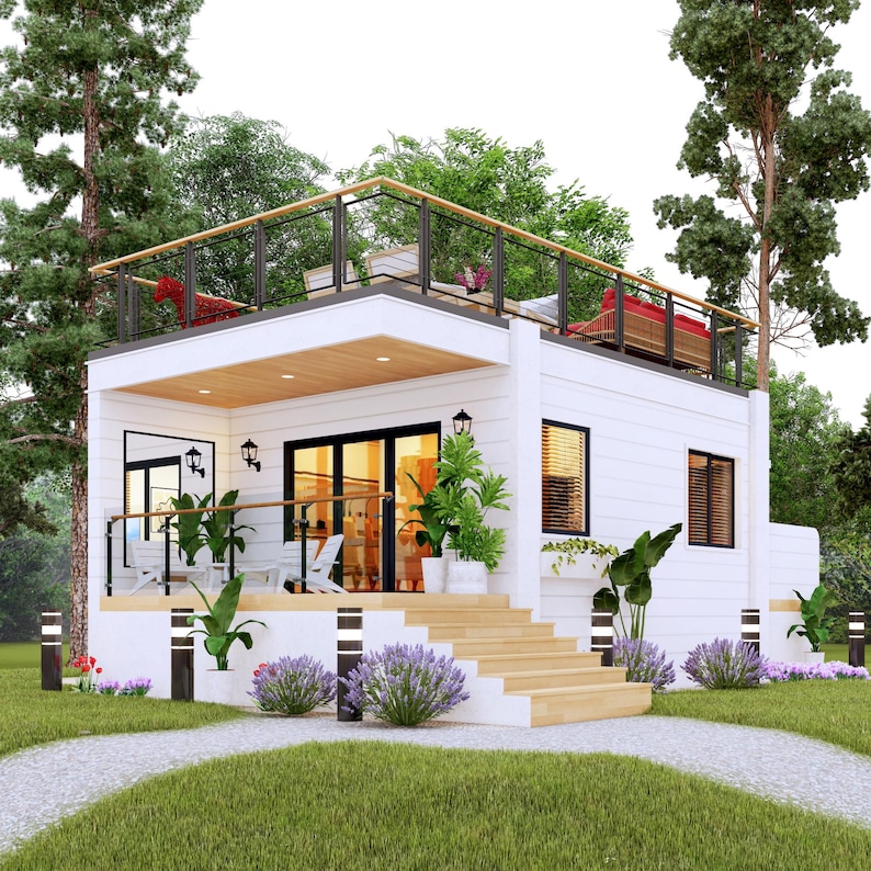 May include: A modern two-story white house with a rooftop deck. The house features black framed windows and doors, a wooden deck, and a staircase leading to the entrance. Landscaping includes green grass, bushes, and trees. The rooftop deck has a black railing and seating.