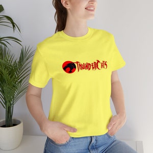Thundercats Logo T-Shirt, Premium Unisex made from Airlume cotton, Retail-Fit, Fair Labor and Platinum Wrap, ideal for fans and nostalgia Yellow