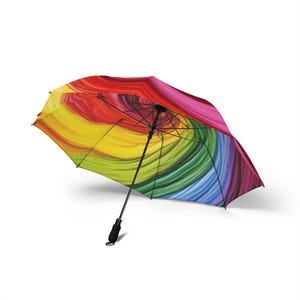 May include: An open umbrella with a vibrant, swirling rainbow pattern. The umbrella's canopy features a spectrum of colors, including red, orange, yellow, green, blue, and purple. It has a black handle and frame, and is set against a white background.