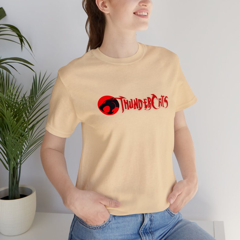 Thundercats Logo T-Shirt, Premium Unisex made from Airlume cotton, Retail-Fit, Fair Labor and Platinum Wrap, ideal for fans and nostalgia Soft Cream