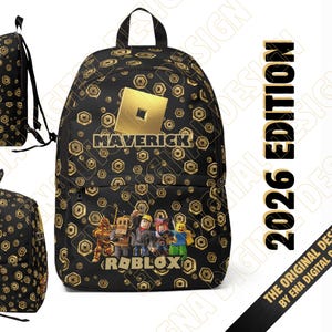 May include: A black backpack featuring a repeating gold geometric pattern, a central gold square logo, the name MAVERICK, and a graphic of four Roblox characters above the Roblox logo. The design includes adjustable straps and a top handle.