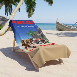 May include: A beach towel featuring a blue and tan gradient background with the red Roblox logo at the top. The text reads "Vacation Mode:" and "LEONARD" in red letters. A group of blocky, stylized character figures are printed in the center.