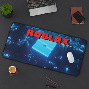 May include: A rectangular desk mat featuring a dark blue background with a glowing light blue digital circuit pattern. The red Roblox logo is printed in the center, accompanied by the white cursive text "for ever" positioned below the logo.