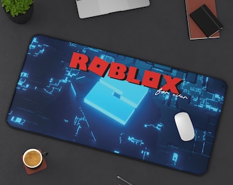 May include: A rectangular desk mat featuring a dark blue background with a glowing light blue digital circuit pattern. The red Roblox logo is printed in the center, accompanied by the white cursive text "for ever" positioned below the logo.