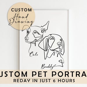 May include: A framed minimalist line drawing of two dogs, with the names "Oslo" and "Buddy" beneath. The artwork is a custom hand drawing, with the text "CUSTOM PET PORTRAIT" and "REDAY IN JUST 6 HOURS" at the bottom of the print.