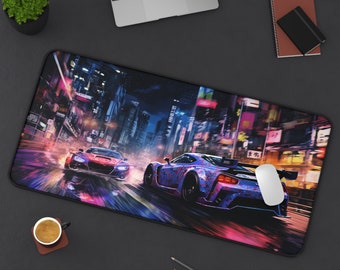 May include: A black and blue gaming mouse pad with a city scene and two cars racing through the streets. The cars are a blue and purple car and a red car. The city scene is lit up with neon lights.