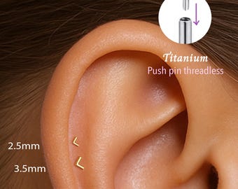 May include: Close-up of an ear with two small, gold-colored, L-shaped earrings. The text "2.5mm" and "3.5mm" are next to the earrings. A diagram shows how to insert a titanium push pin threadless earring.