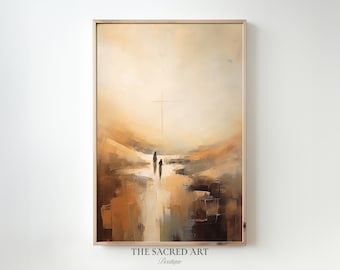 Puede incluir: Pintura abstracta de tres figuras caminando hacia una cruz en un paisaje con tonos marrones, amarillos y blancos. La pintura está enmarcada en un marco de madera claro.